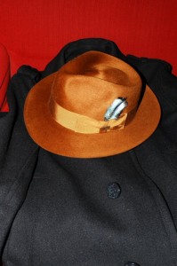 A Biltmore Reese Eleganza fedora on a navy blue peacoat